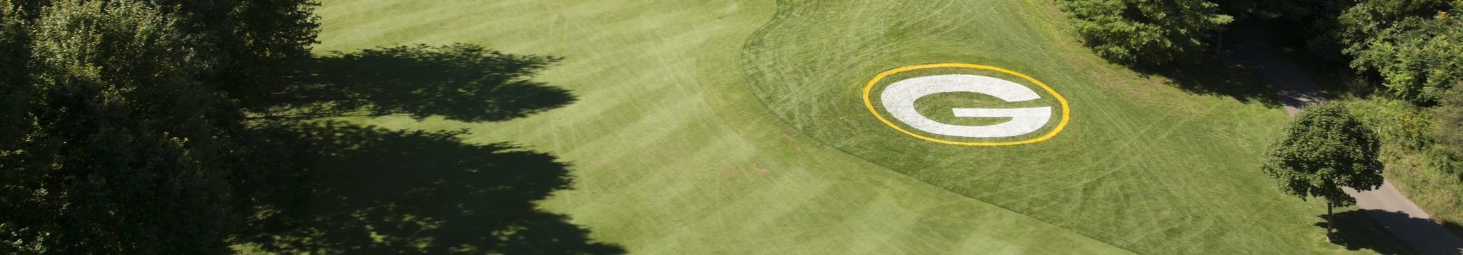View of golf course with Green Bay Packers Logo